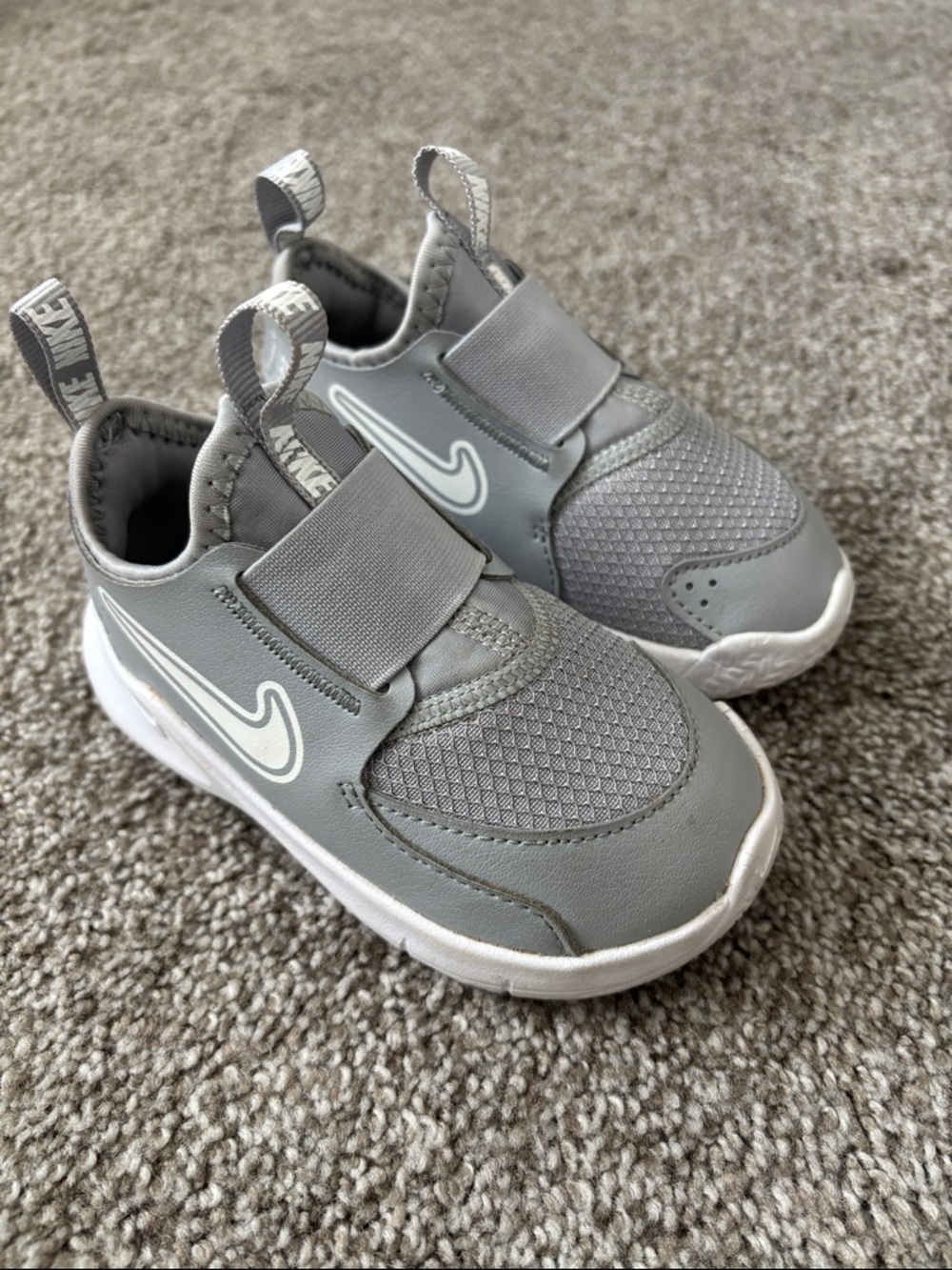 Nike Toddler Grey Slip-On Sneakers with White Swoosh